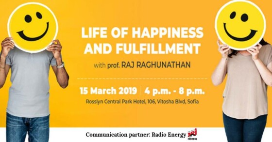Smiley face cutouts held by prof. Raj Raghunathan and Happiness Academy team member for seminar in Sofia on Life of Happiness and Fulfillment